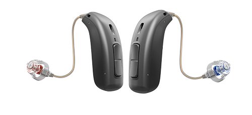 To høreapparater fra Oticon med diskret design vises med sorte huse og gennemsigtige ørepropper, markeret med rød og blå farve. Perfekt til brug i høreklinikker og høreløsninger.