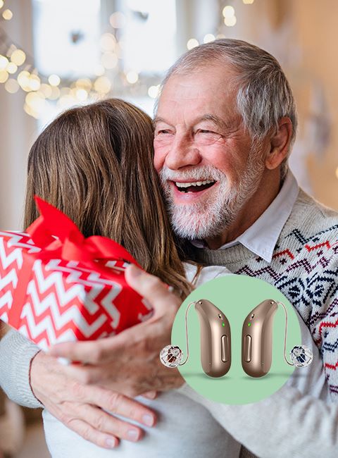 abuelo abrazando a su nieta y sonriendo. audifonos audika destacados