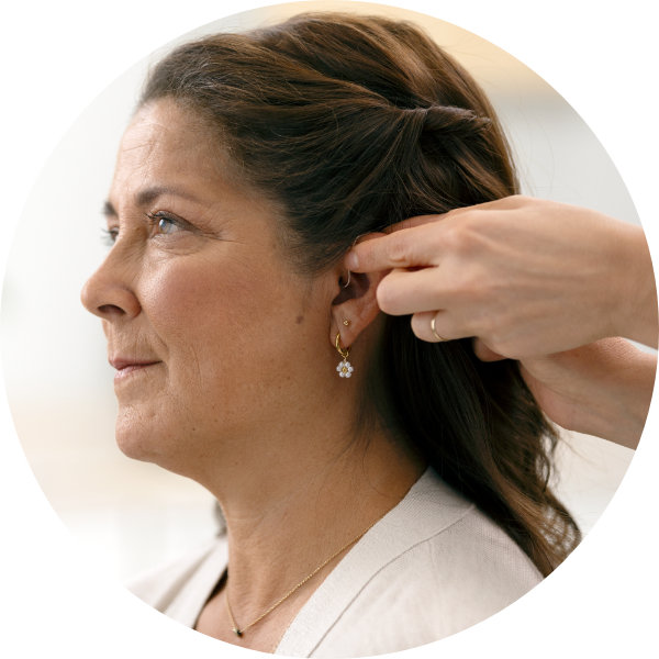 Image shows ear being examed