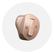 Aparat słuchowy Oticon Own™ ITE HS douszny, beżowy, z pokrętłami regulacji.