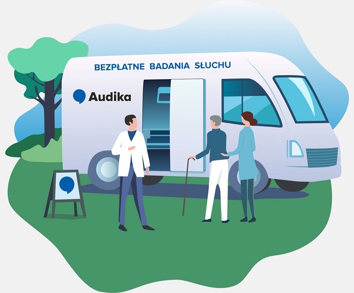 Mobilny gabinet Audikabus oferujący bezpłatne badania słuchu, lekarz rozmawia z dwiema osobami na zewnątrz.