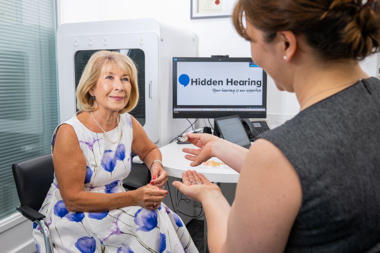 Jennie Bond receiving professional hearing care consultation at Audika