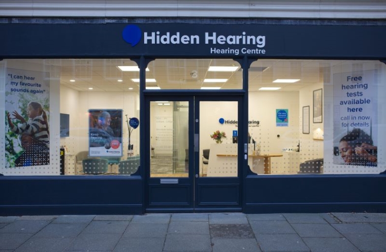 Audika Chichester branch entrance with branded signage and window displays