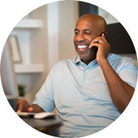 Image shows a business man talking on the phone