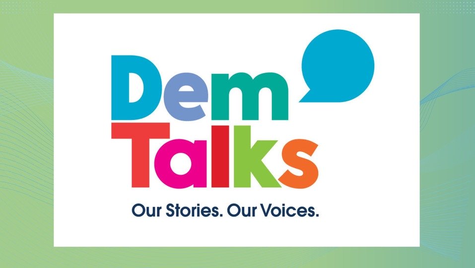 The design features the bold, colorful text 'Dem Talks,' styled in blue, green, pink, red, and orange, accompanied by a blue speech bubble. Below, the tagline reads, 'Our Stories. Our Voices.' The white background is framed by a light green gradient with subtle wave patterns.