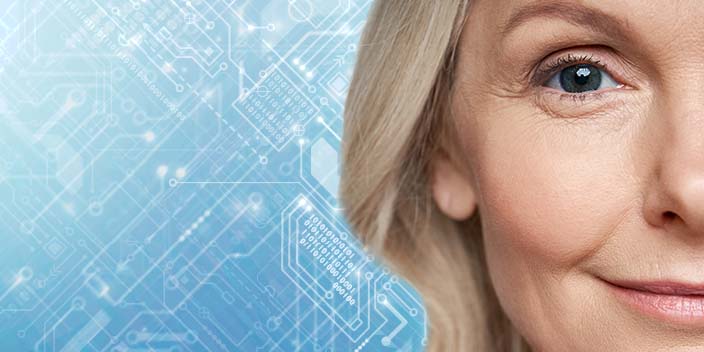 [GEN] A visible ear with blonde hair is on the right, overlaid with a blue circuit board design symbolizing technology advancements in hearing care. No text or identifiable hearing aid branding is present.