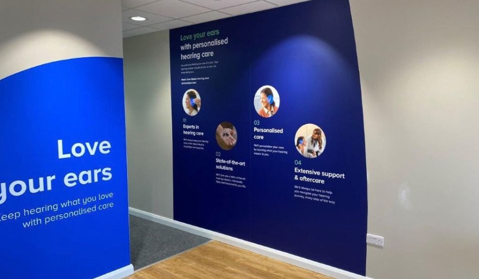 Interior photograph of Hidden Hearing Blanchardstown with decals on the wall highlighting its value proposition 