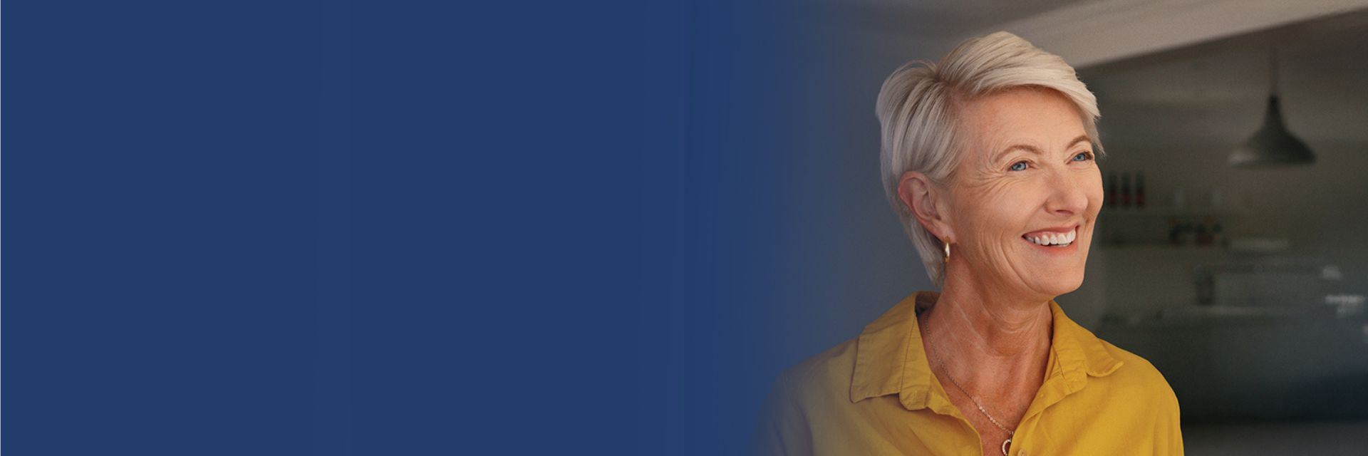 Woman in yellow top smiling