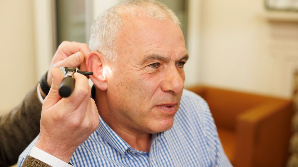 Image shows woman during hearing test