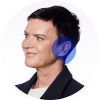 A photograph of audiologist Alison O'Sullivan smiling with a blue speech bubble overlayed over her ear