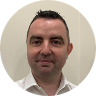 A photograph of Hidden Hearing audiologist Damien O'Brien