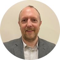 A photograph of hearing aid audiologist Fergal Stynes smiling