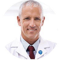 Professional audiologist wearing a white coat and red tie