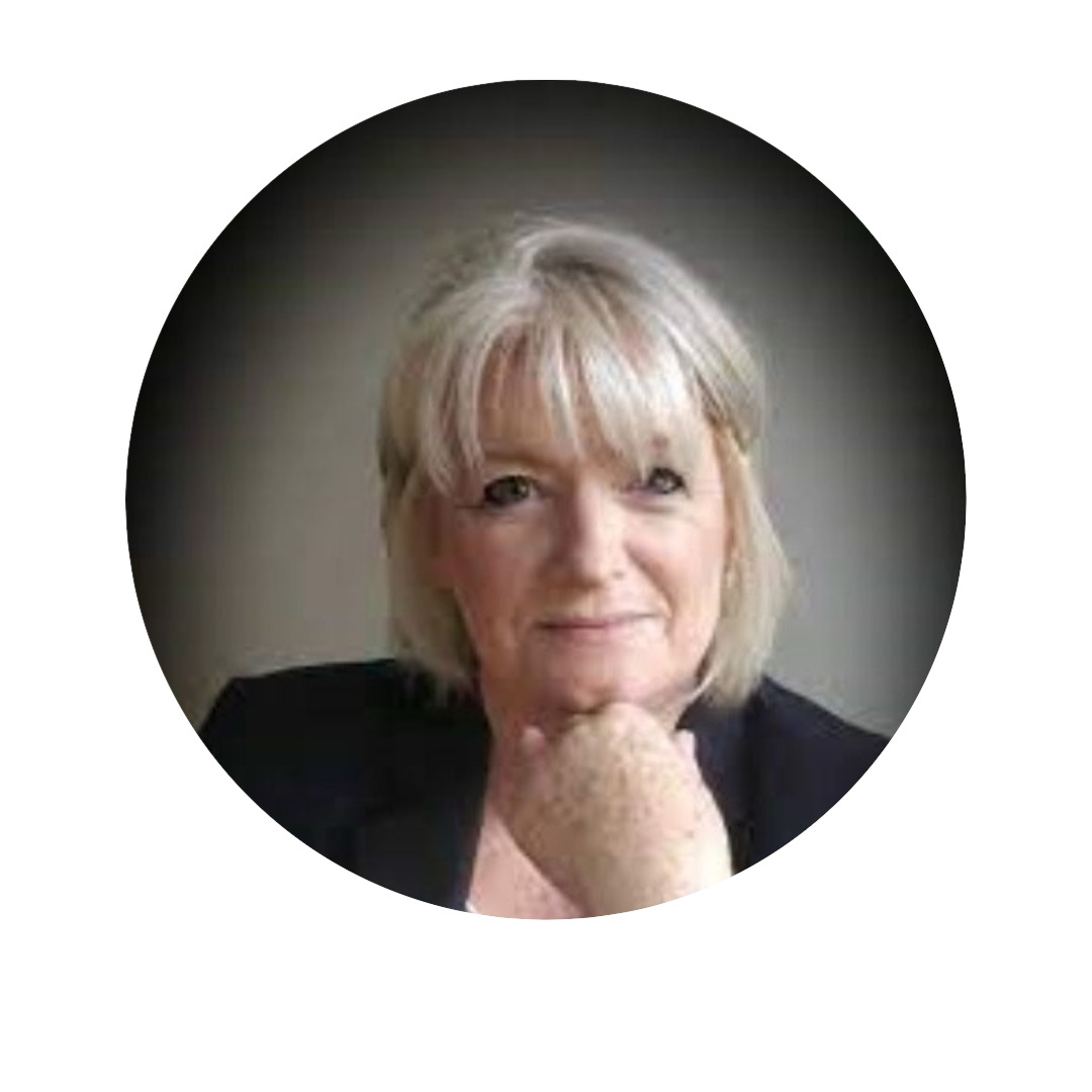 [GEN] A person with shoulder-length blonde hair is seated in a dimly lit environment, wearing a dark blazer. Their face is obscured with a blur, and no text or identifiable branding is visible.