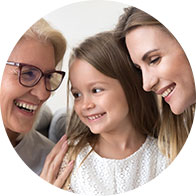 [GEN] Three individuals are closely positioned together in a well-lit indoor setting, with their faces blurred. One person wears glasses, and the central figure dons a white textured top. No identifiable hearing aids, text, or branding is visible.