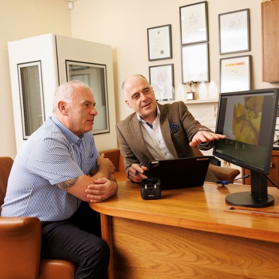 Woman audiologist with patient