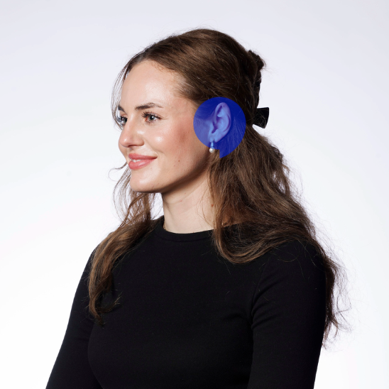 Audiologist Johane wearing a black top with long hair tied back and a focus on hearing care expertise.