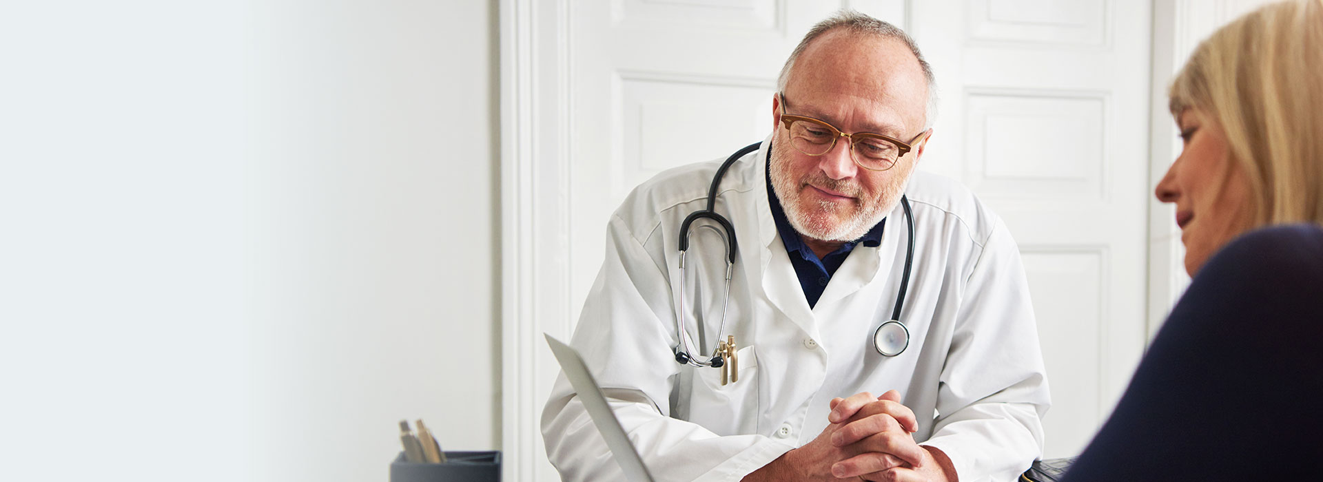 image shows audiologist with patient