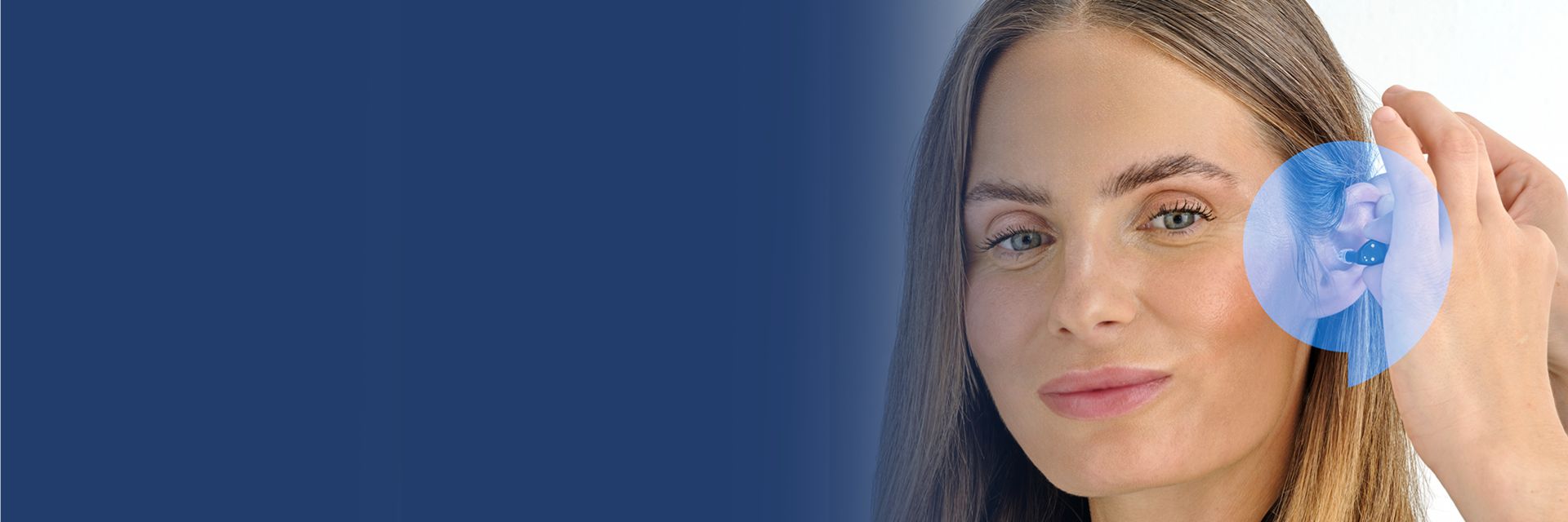 Woman smiling while getting fitted with Oticon Zeal hearing aid