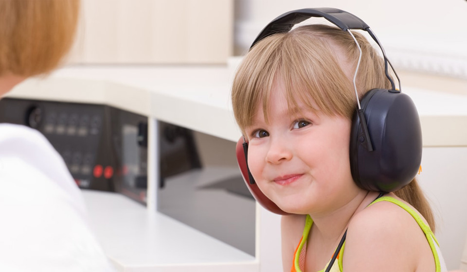 Image shows a child getting a hearing test