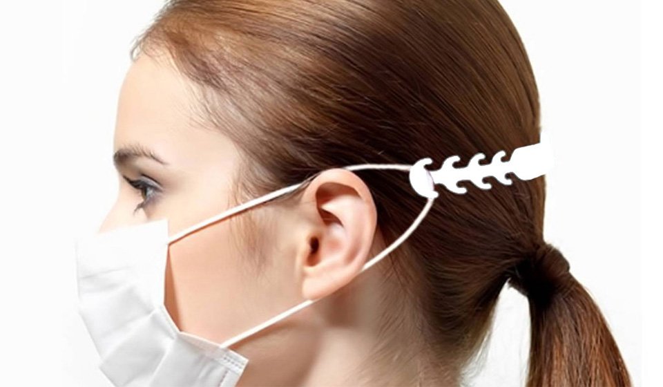 Girl wearing a face mask with an adjustable strap relieving pressure on the ears.