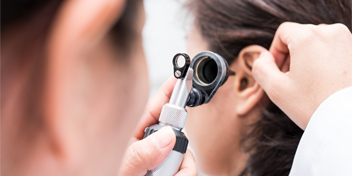 Fitting a hearing aid into a patient’s ear