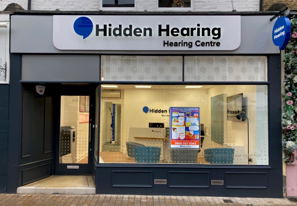 Hidden Hearing Bromley clinic storefront featuring branded signage and a welcoming interior with seating visible through the glass.