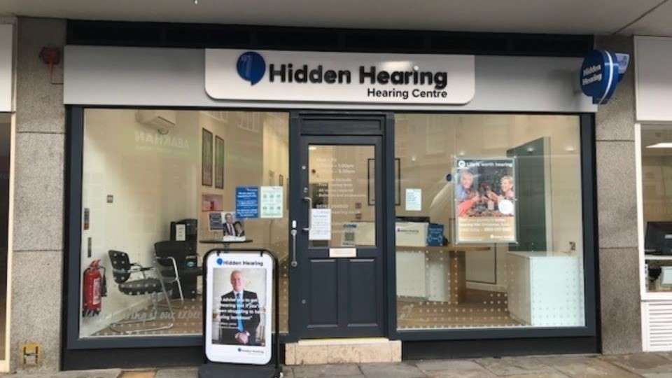 Hidden Hearing Shrewsbury clinic storefront with clear signage and glass windows displaying posters.