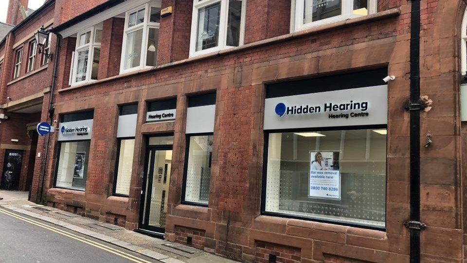 Hidden Hearing Sheffield clinic storefront with brick facade and signage