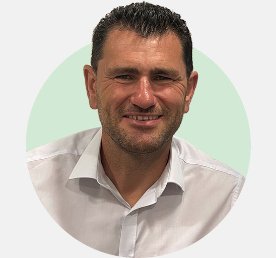 Gordon Bruce, hearing care specialist wearing a white shirt