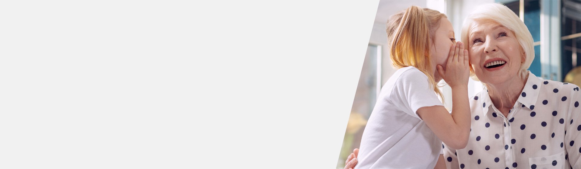 Woman with high frequency hearing loss trying to hear her granddaughter whispering.