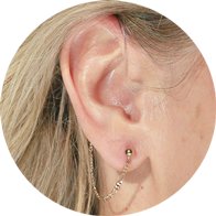 Gold Figaro chain accessory for hearing aid users, designed for both functionality and style.