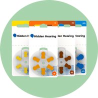 Hidden Hearing branded hearing aid batteries in yellow, orange, brown, and blue packaging.