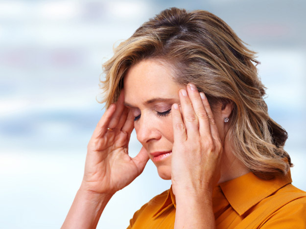 Woman suffering from tinnitus