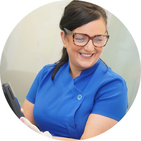 Hearing care specialist in professional uniform conducting a consultation.