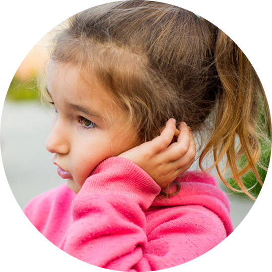 Child holding ear in discomfort, potentially indicating a middle ear infection