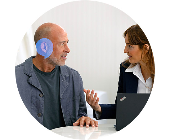 A man receives hearing advice from a Hidden Hearing audiologist
