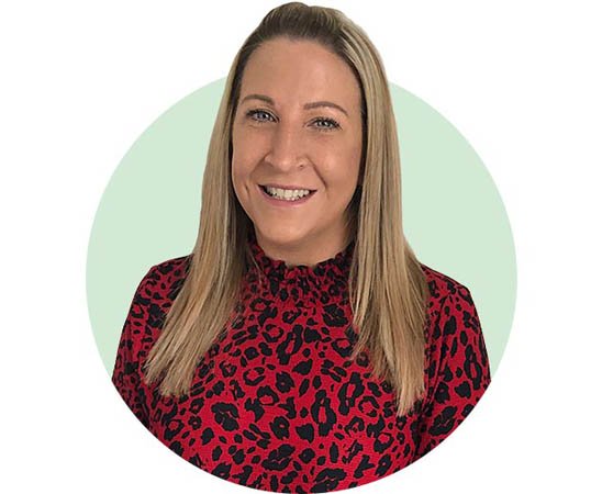 Hidden Hearing audiologist Jen Canham in a red leopard-print blouse