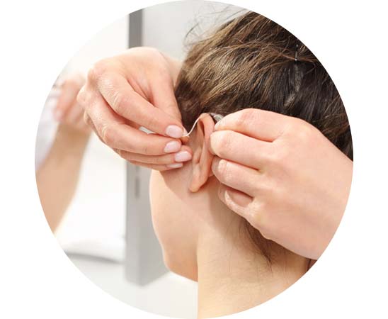 Fitting a behind-the-ear hearing aid on a person with congenital hearing loss