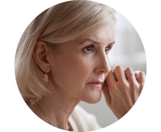 Woman experiencing anxiety possibly linked to untreated hearing loss