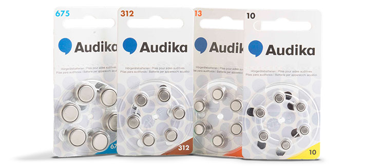 Hoorapparaatbatterijen van verschillende types en maten, inclusief 675, 312, 13 en 10, verpakt met Audika-branding.
