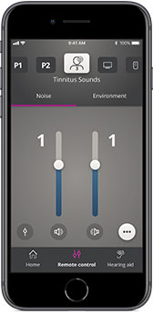 A smartphone screen displays an app interface for managing tinnitus sounds, showing adjustable sliders labeled '1' under 'Noise' and 'Environment.' Buttons for 'Home,' 'Remote control,' and 'Hearing aid' are visible. Oticon-compatible settings appear, indicating integration with hearing aids.