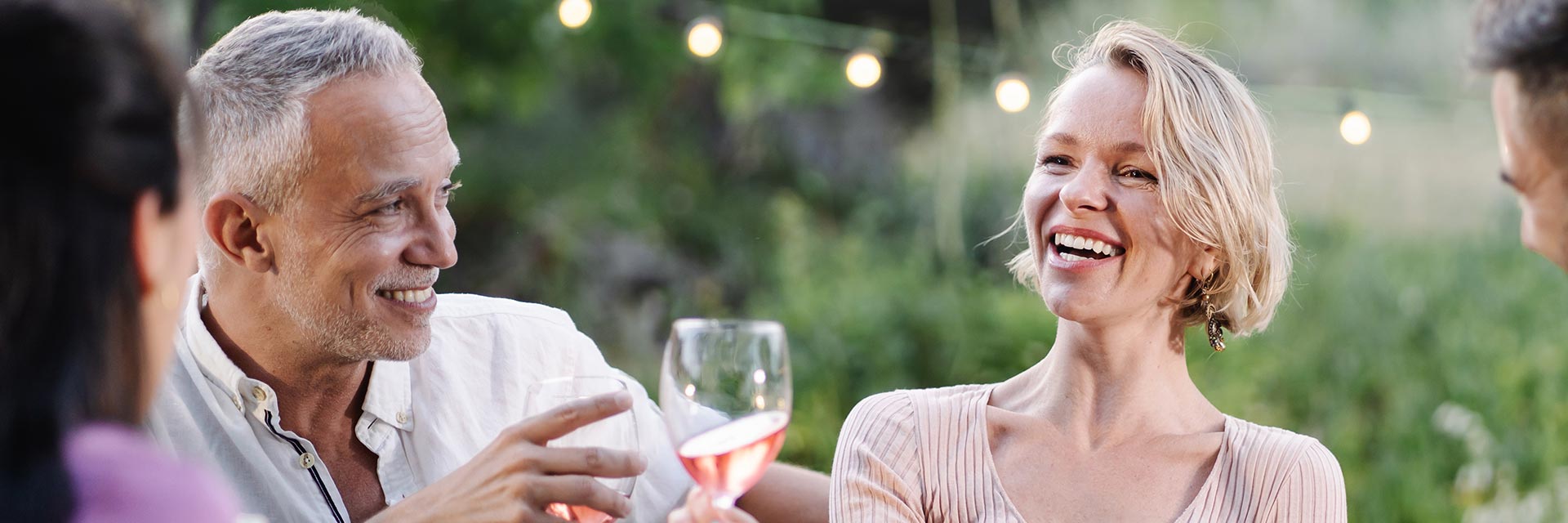 Image show happy man with people at a dinner table