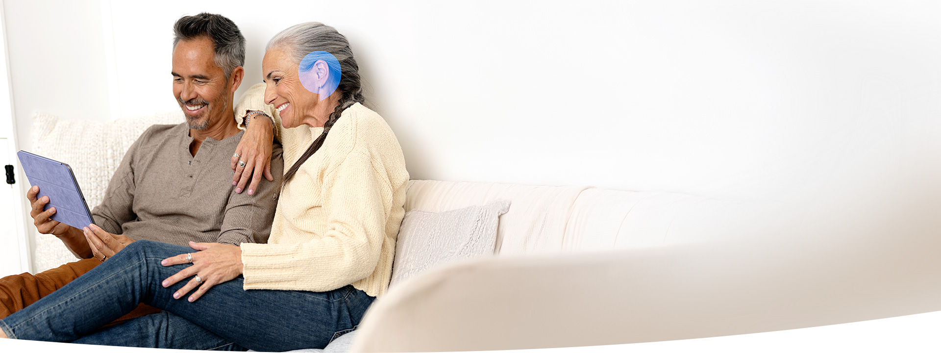 A couple taking an online hearing test