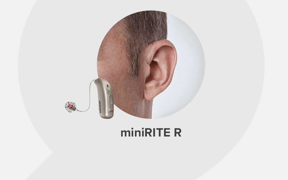 A discreet Oticon miniRITE R hearing aid rests behind a man's ear, connected to a thin wire and earpiece in a light gray background. Text reads: 'miniRITE R.'