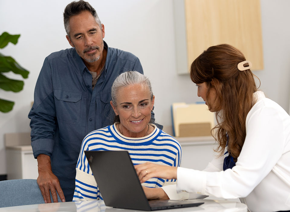 A lady getting hearing advice from an audiologist