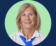 A person with shoulder-length blonde hair wearing a white shirt and blue scarf against a green circular background, bordered by dark blue.