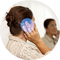 mujer sosteniendo su oído con representación visual de pérdida auditiva