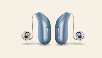 blue behind-the-ear hearing aids with slim tubes and clear earpieces