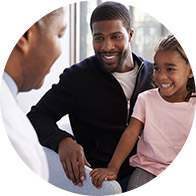 image shows happy people looking at audiologist